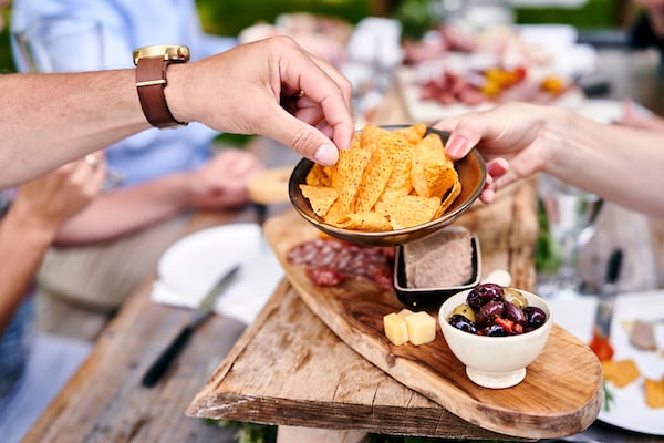 Consumers eating chips
