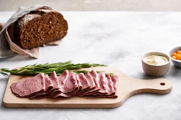 Meat pastrami slices on a cutting board